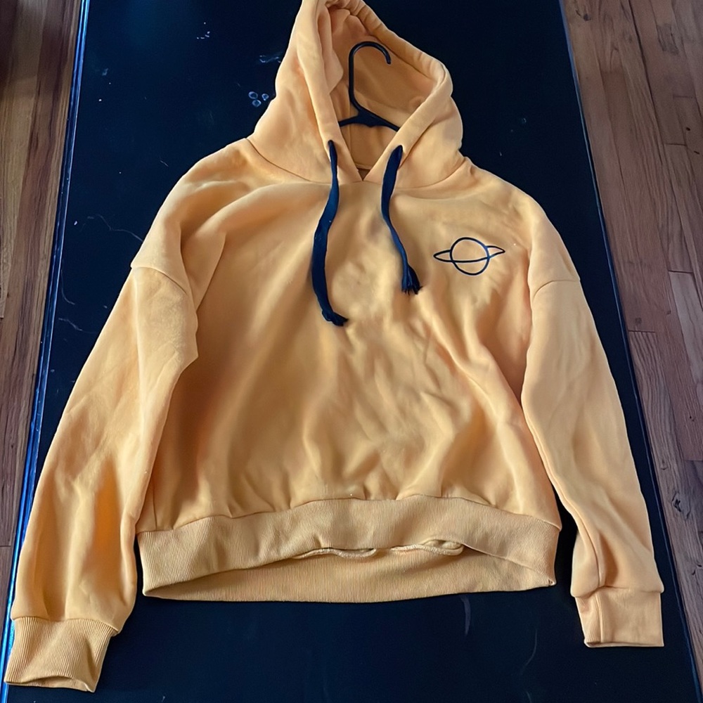 Small yellow hoodie with planet detail